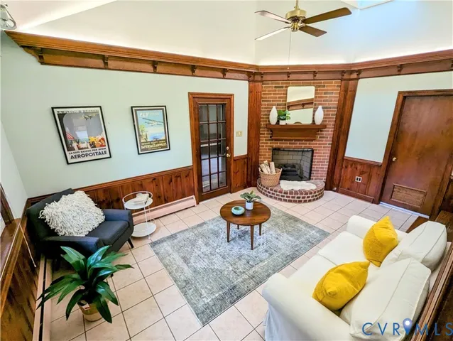 a living room with furniture rug and wooden floor