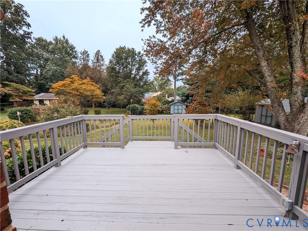 8401 Bronwood Road Henrico, VA 23229 - Photo 9 of 11 a view of balcony with wooden floor and fence