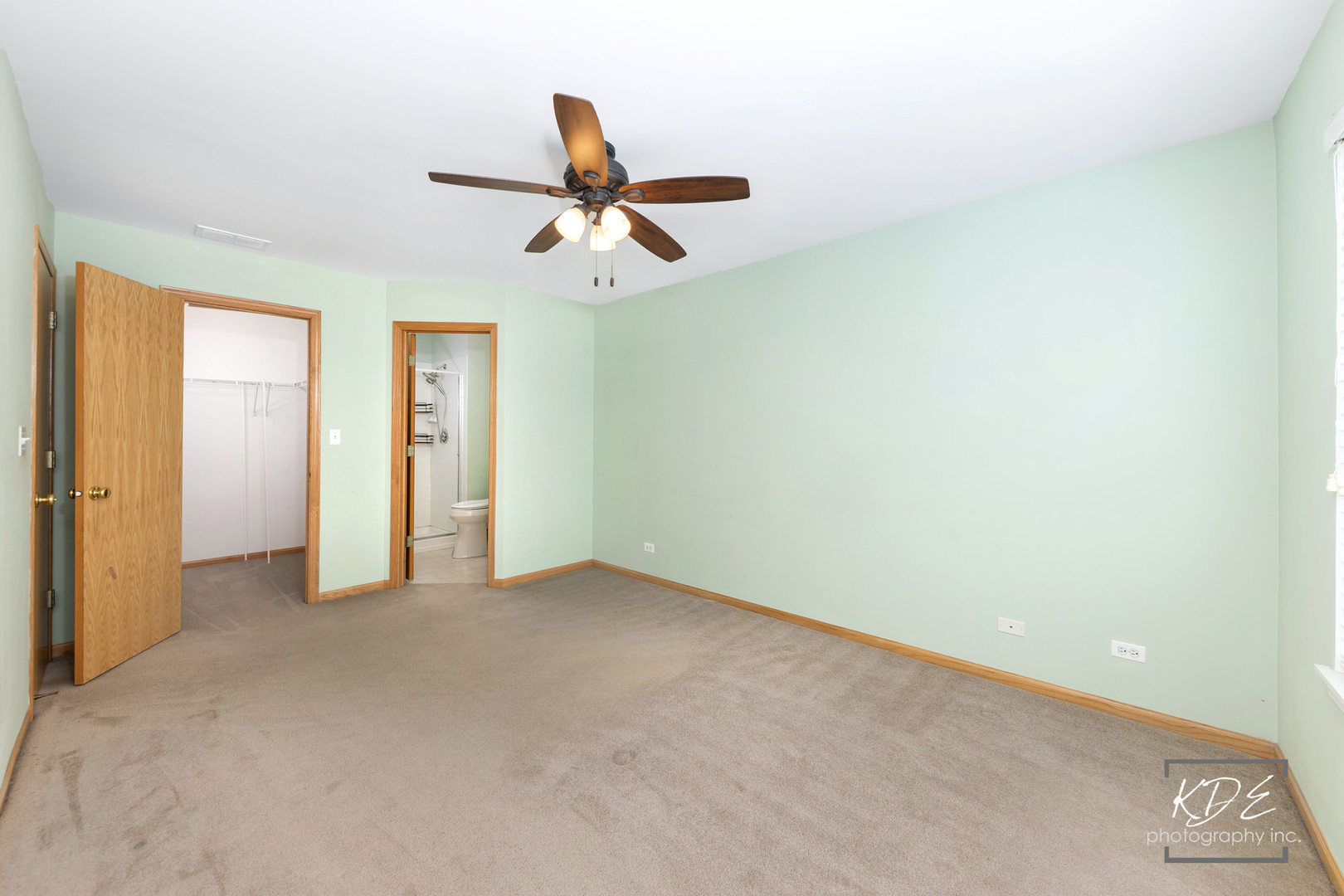 2330 Twilight Drive Aurora, IL 60503 - Photo 14 of 27 an empty room with a ceiling fan and carpet