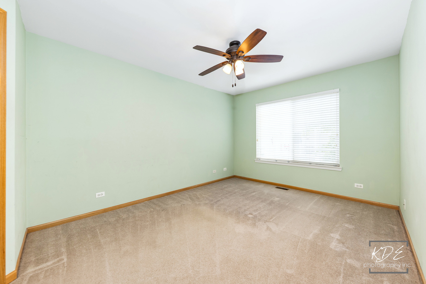 2330 Twilight Drive Aurora, IL 60503 - Photo 17 of 27 an empty room with a window and a ceiling fan