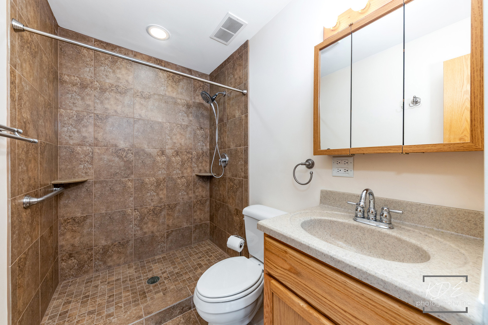 2330 Twilight Drive Aurora, IL 60503 - Photo 24 of 27 a bathroom with a granite countertop sink toilet and shower