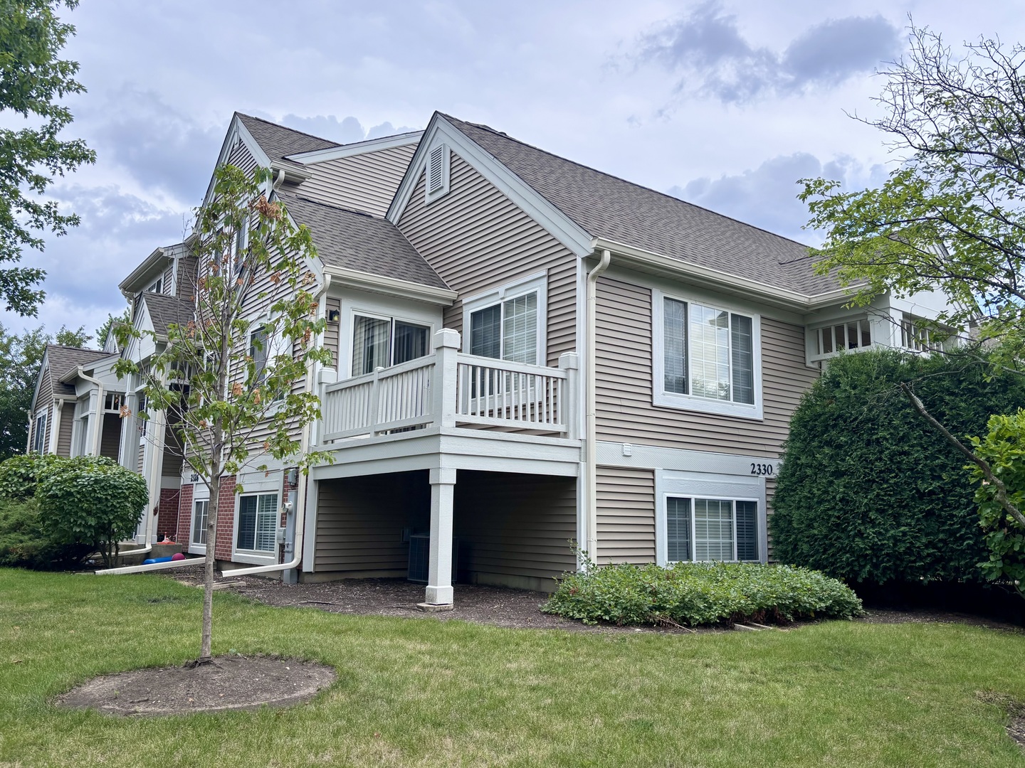 2330 Twilight Drive Aurora, IL 60503 - Photo 27 of 27 a front view of a house with a yard and trees
