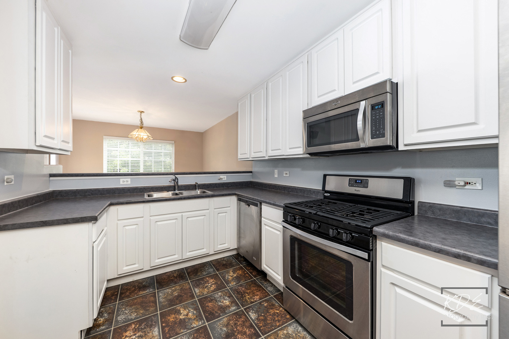 2330 Twilight Drive Aurora, IL 60503 - Photo 5 of 27 a kitchen with stainless steel appliances granite countertop a sink and a stove