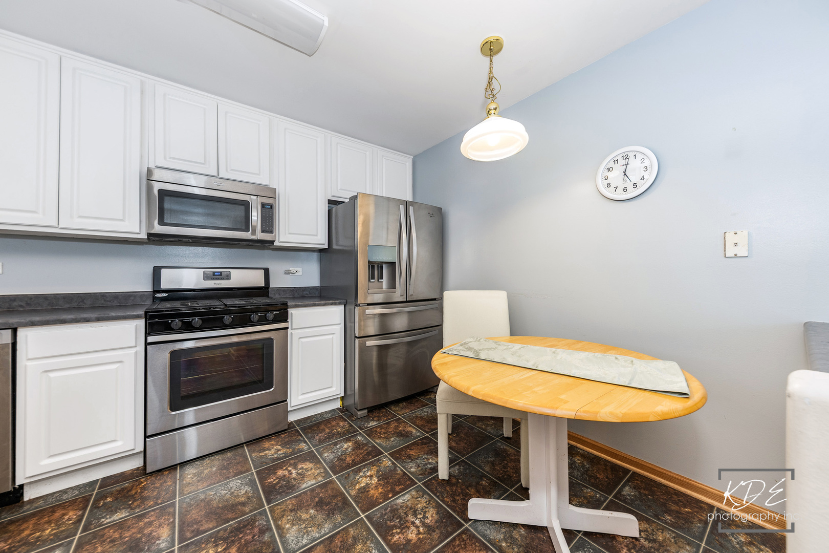 2330 Twilight Drive Aurora, IL 60503 - Photo 6 of 27 a kitchen with stainless steel appliances granite countertop a sink a stove a refrigerator cabinets and chairs