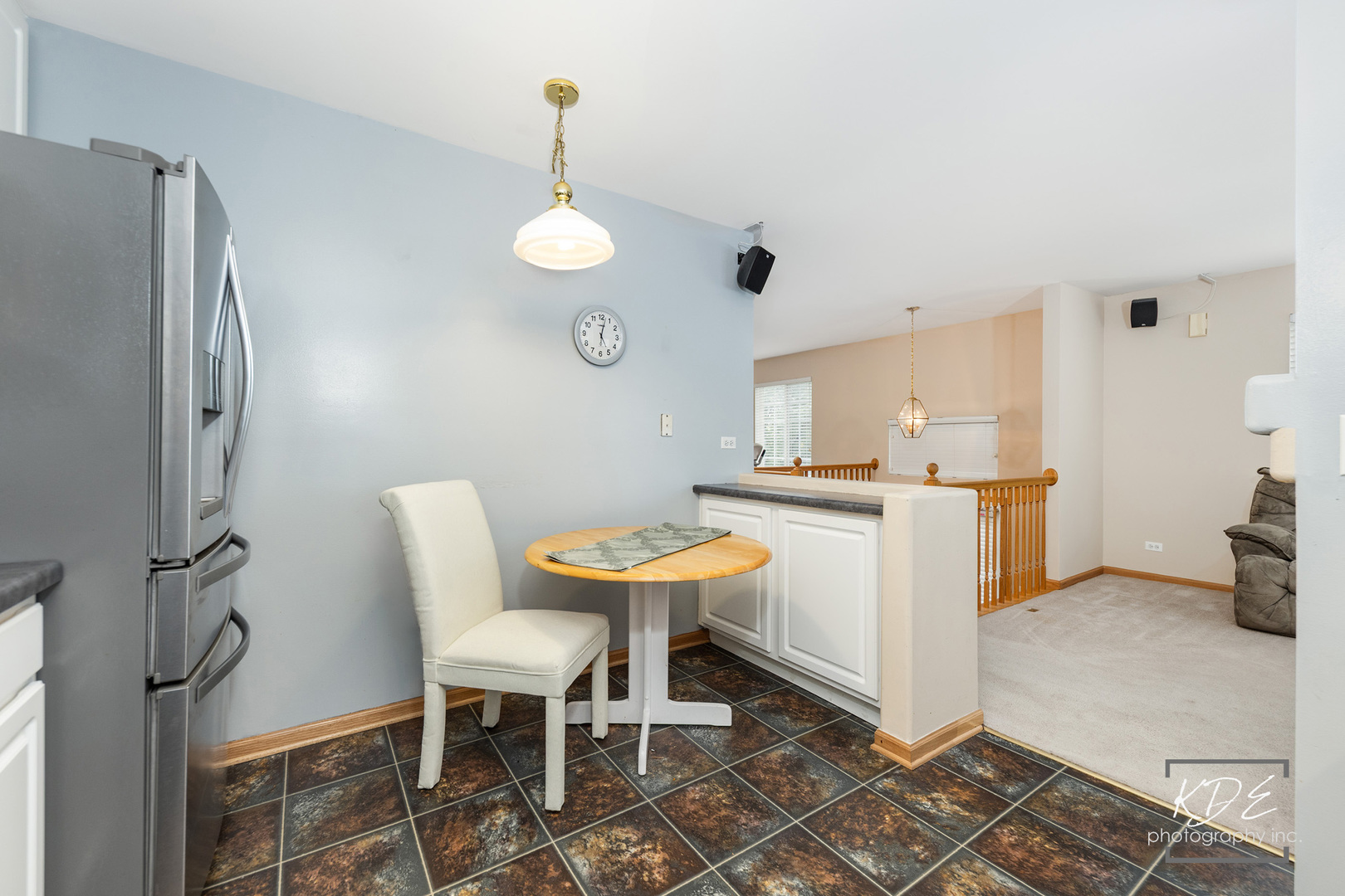 2330 Twilight Drive Aurora, IL 60503 - Photo 7 of 27 a kitchen with stainless steel appliances kitchen island granite countertop dining table chairs and a refrigerator