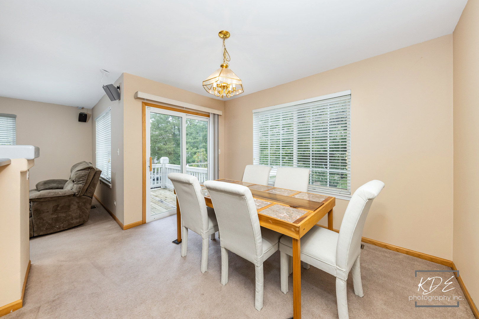 2330 Twilight Drive Aurora, IL 60503 - Photo 8 of 27 a dining room with furniture a chandelier and a rug