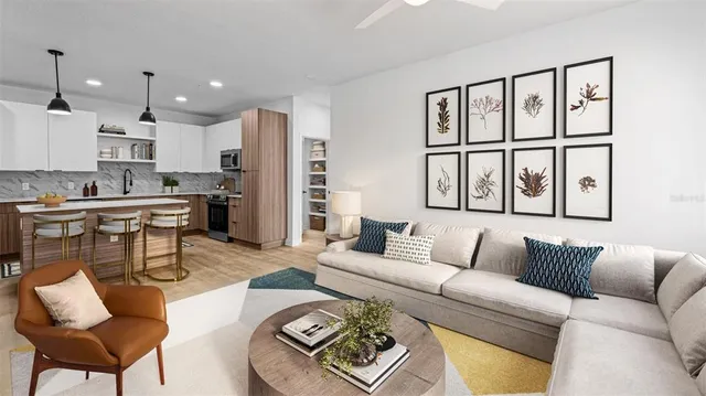 a living room with furniture and a large window