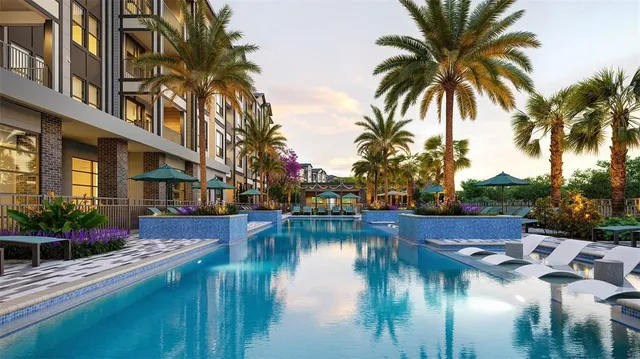 a view of swimming pool with outdoor seating and plants