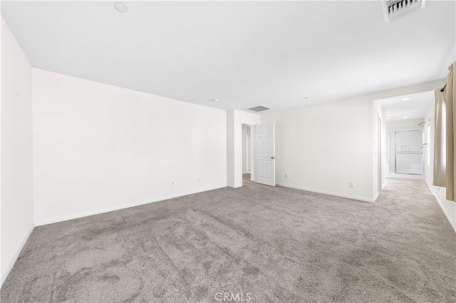 a bedroom with bed and tv with wooden floor