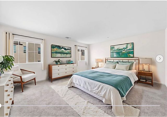 a bedroom with a balcony a bed and a couch