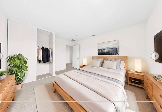 a bathroom with a granite countertop sink a toilet and a bathtub