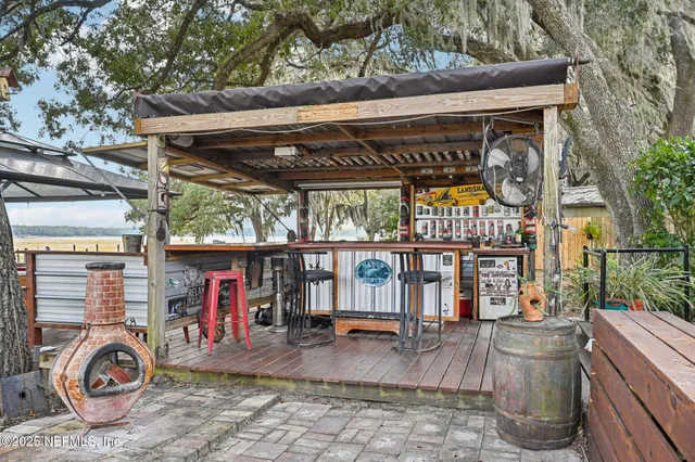 a view of house with outdoor space and sitting area