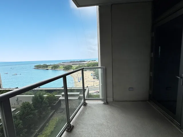 a view of an empty room and floor to ceiling window