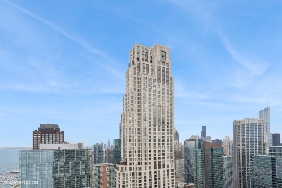 600 North Lake Shore Drive, Unit 1110 Chicago, IL 60611 - Photo 20 of 35 a tall building sitting next to a city view