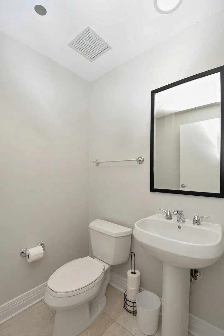600 North Lake Shore Drive, Unit 1110 Chicago, IL 60611 - Photo 10 of 35 a bathroom with a sink toilet and mirror