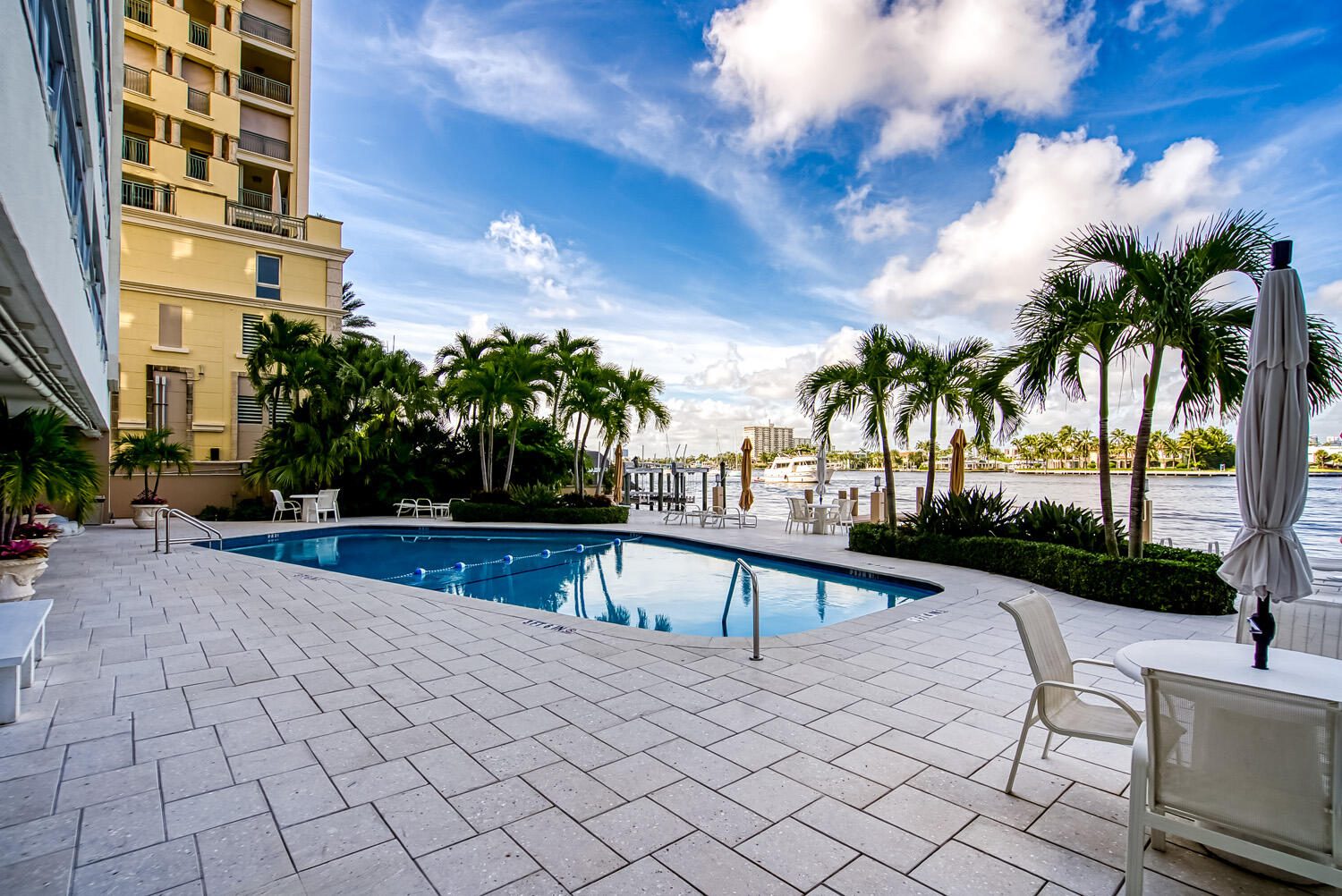 215 North Birch Road, Unit 5B Fort Lauderdale, FL 33304 - Photo 14 of 73 a view of a swimming pool with a patio