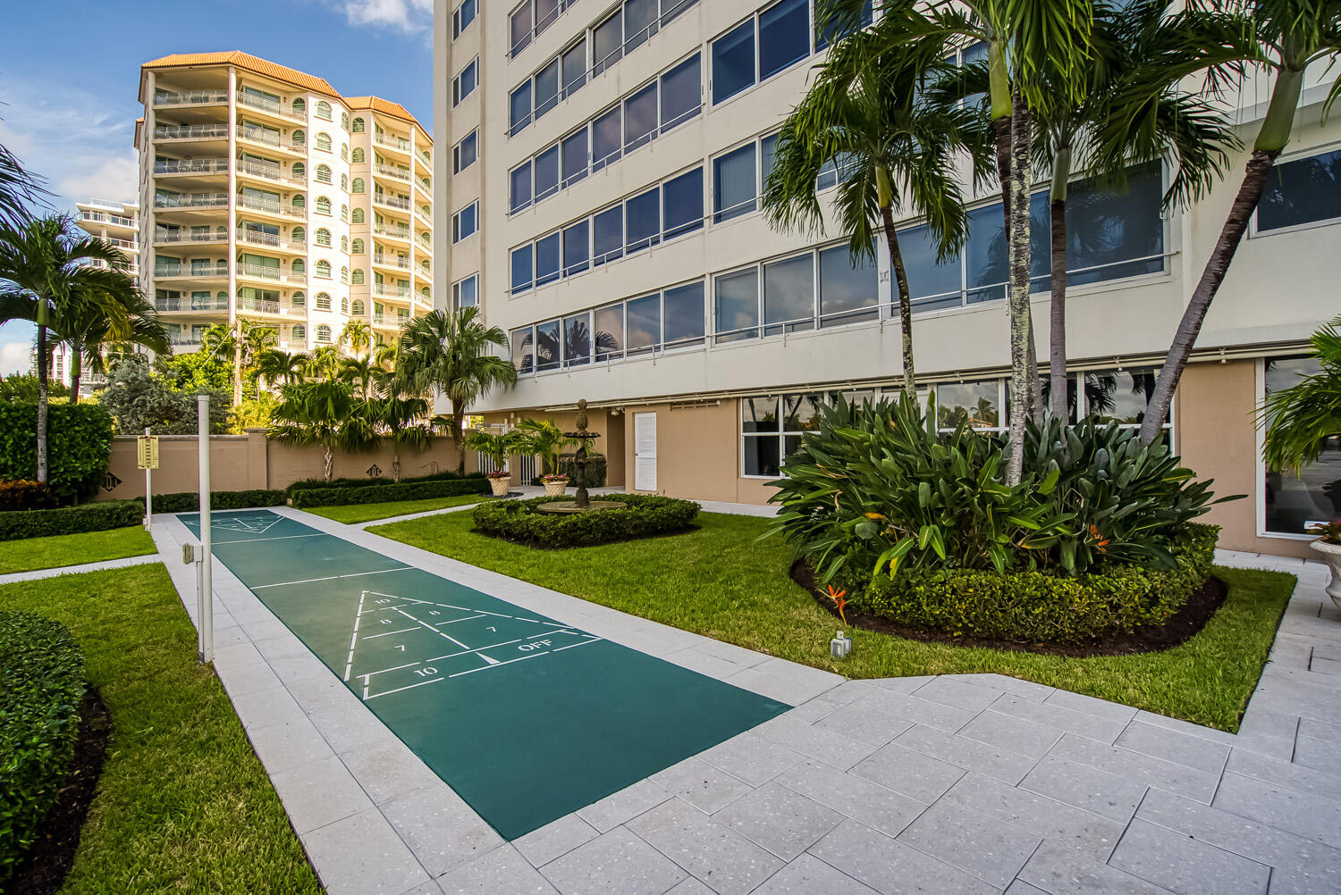 215 North Birch Road, Unit 5B Fort Lauderdale, FL 33304 - Photo 19 of 73 a view of a tall building next to a yard