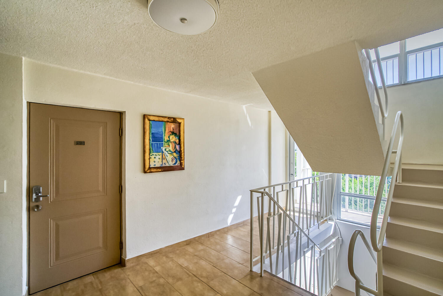 215 North Birch Road, Unit 5B Fort Lauderdale, FL 33304 - Photo 21 of 73 a view of hallway with stairs