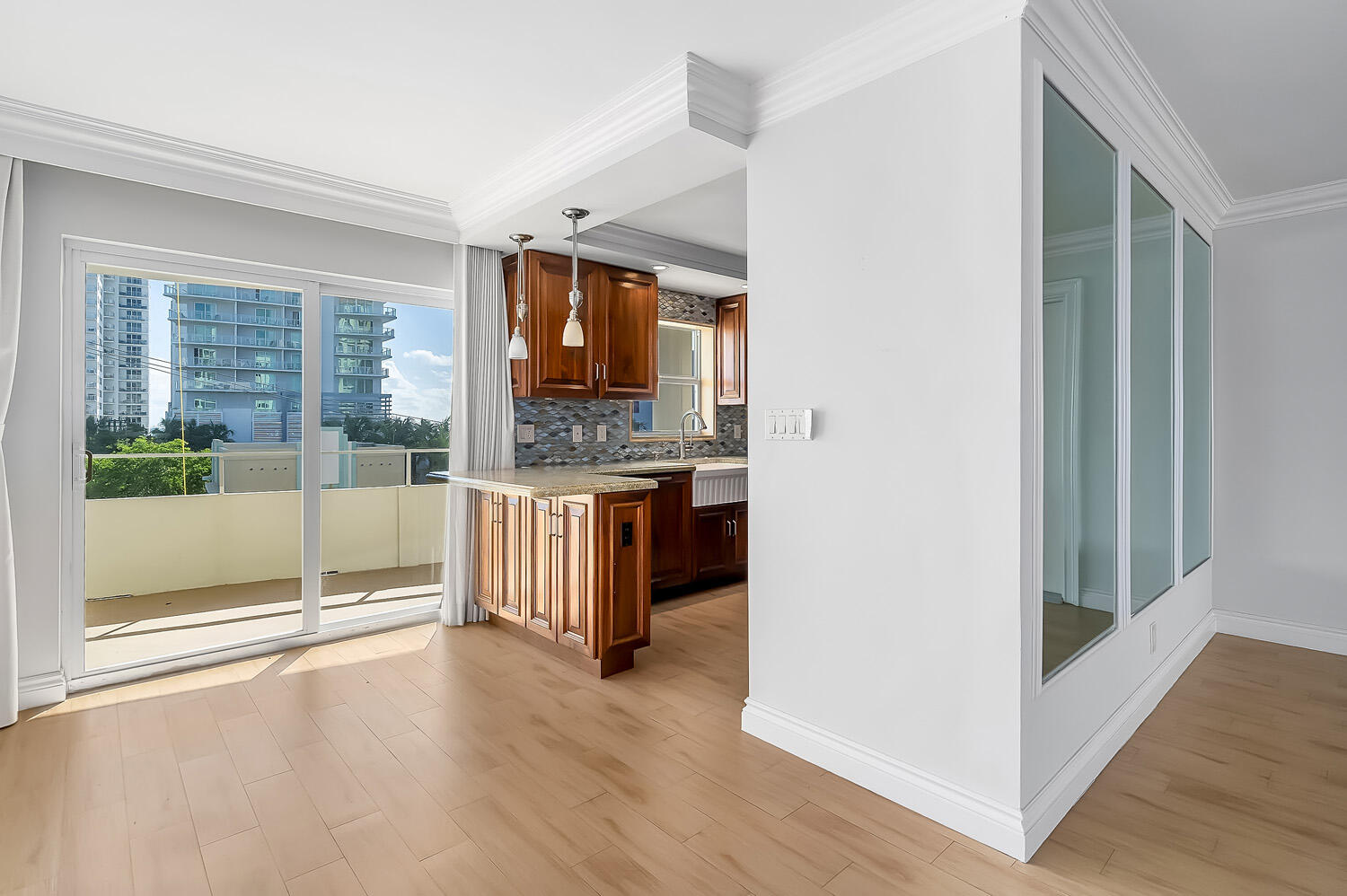 215 North Birch Road, Unit 5B Fort Lauderdale, FL 33304 - Photo 31 of 73 a view of a kitchen with a sink and a large window