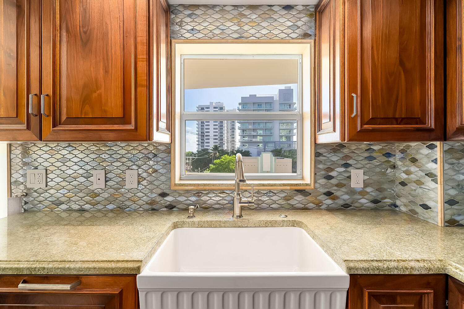 215 North Birch Road, Unit 5B Fort Lauderdale, FL 33304 - Photo 36 of 73 a kitchen with granite countertop sink and window