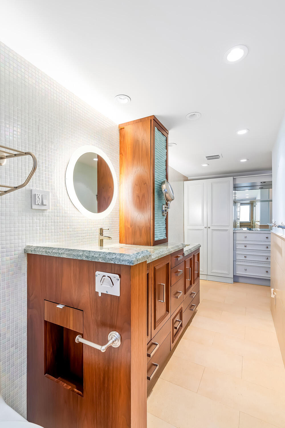 215 North Birch Road, Unit 5B Fort Lauderdale, FL 33304 - Photo 52 of 73 a bathroom with double vanity and a mirror