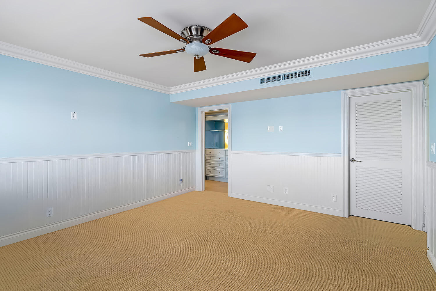 215 North Birch Road, Unit 5B Fort Lauderdale, FL 33304 - Photo 58 of 73 an empty room with a ceiling fan and wooden floor