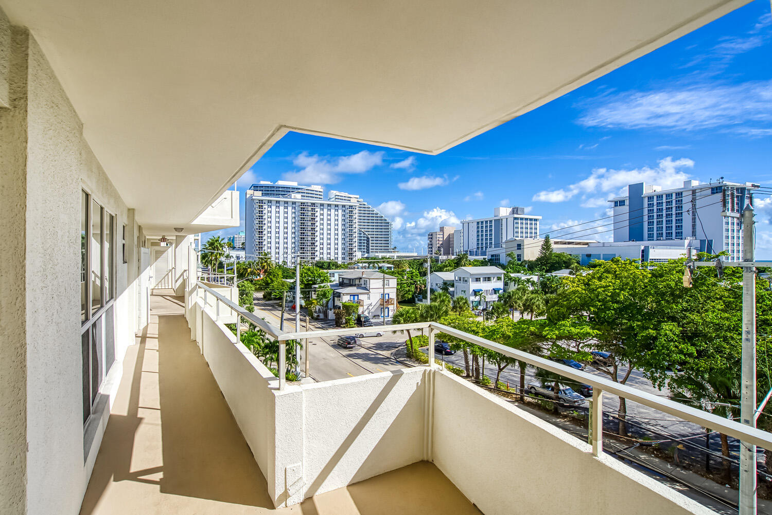 215 North Birch Road, Unit 5B Fort Lauderdale, FL 33304 - Photo 64 of 73 a view of a balcony with potted plants and wooden fence