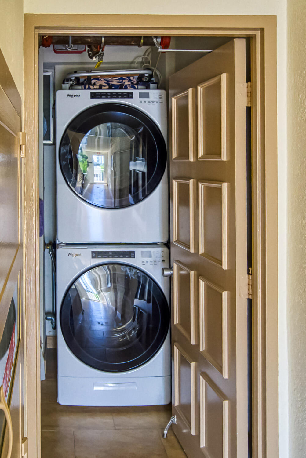 215 North Birch Road, Unit 5B Fort Lauderdale, FL 33304 - Photo 67 of 73 a utility room with wooden floor and washing machine