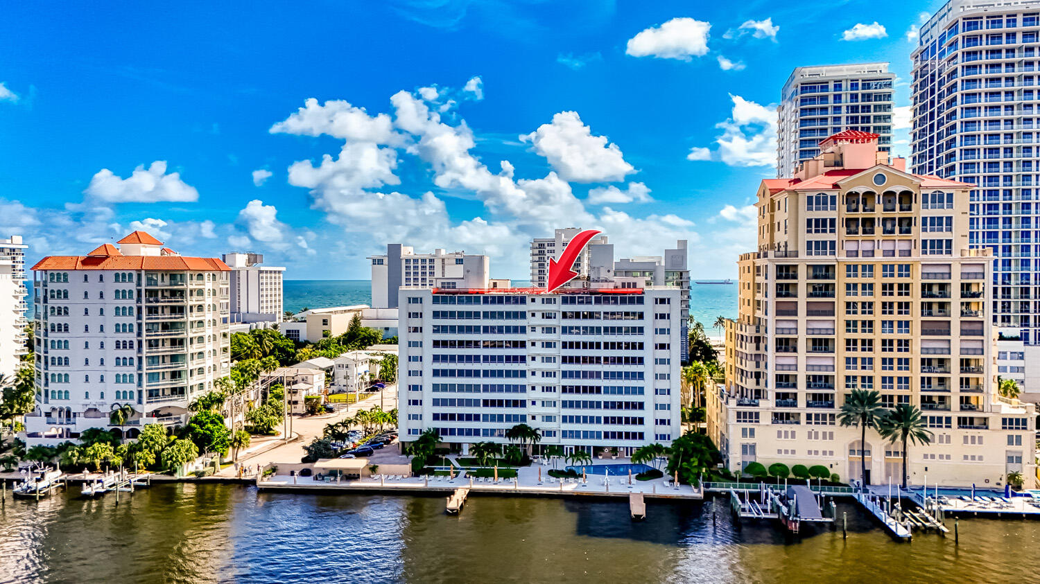 215 North Birch Road, Unit 5B Fort Lauderdale, FL 33304 - Photo 7 of 73 a front view of a building with swimming pool and a yard