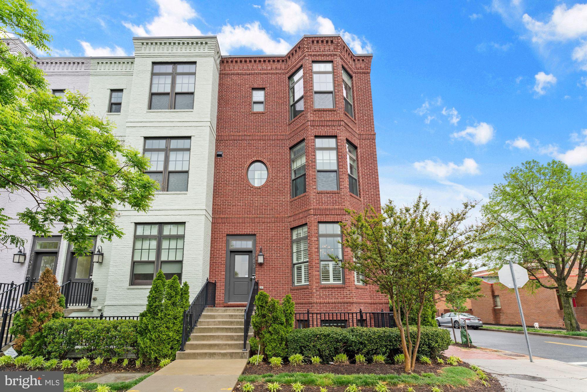 a front view of a building with garden
