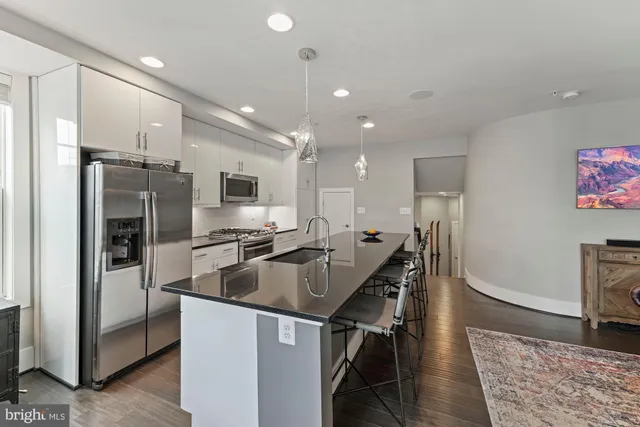 a kitchen with lots of counter top space and living room