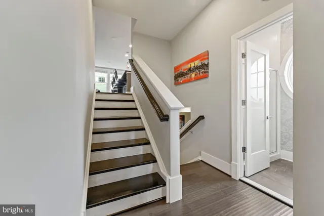 a kitchen with kitchen island a counter top space stainless steel appliances and a counter top space