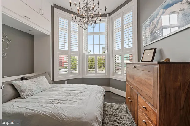 a view of entryway with wooden floor and stairs