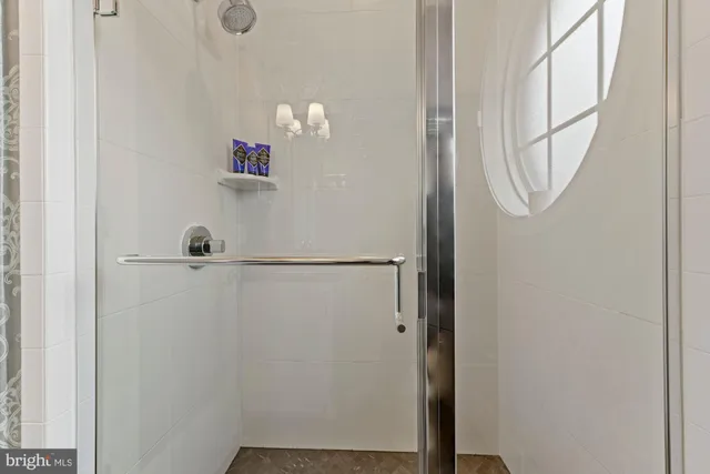 a bathroom with a granite countertop sink toilet and a mirror