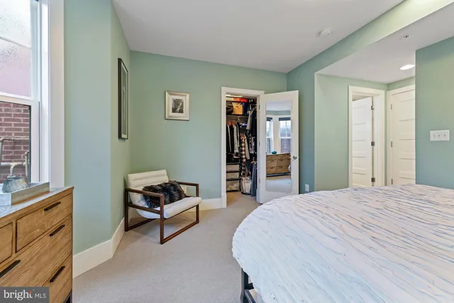 a bed room with a bed and a window