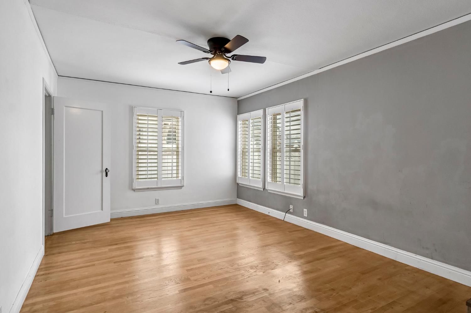 215 East Clinton Avenue Fresno, CA 93704 - Photo 14 of 29 wooden floor in an empty room with a window