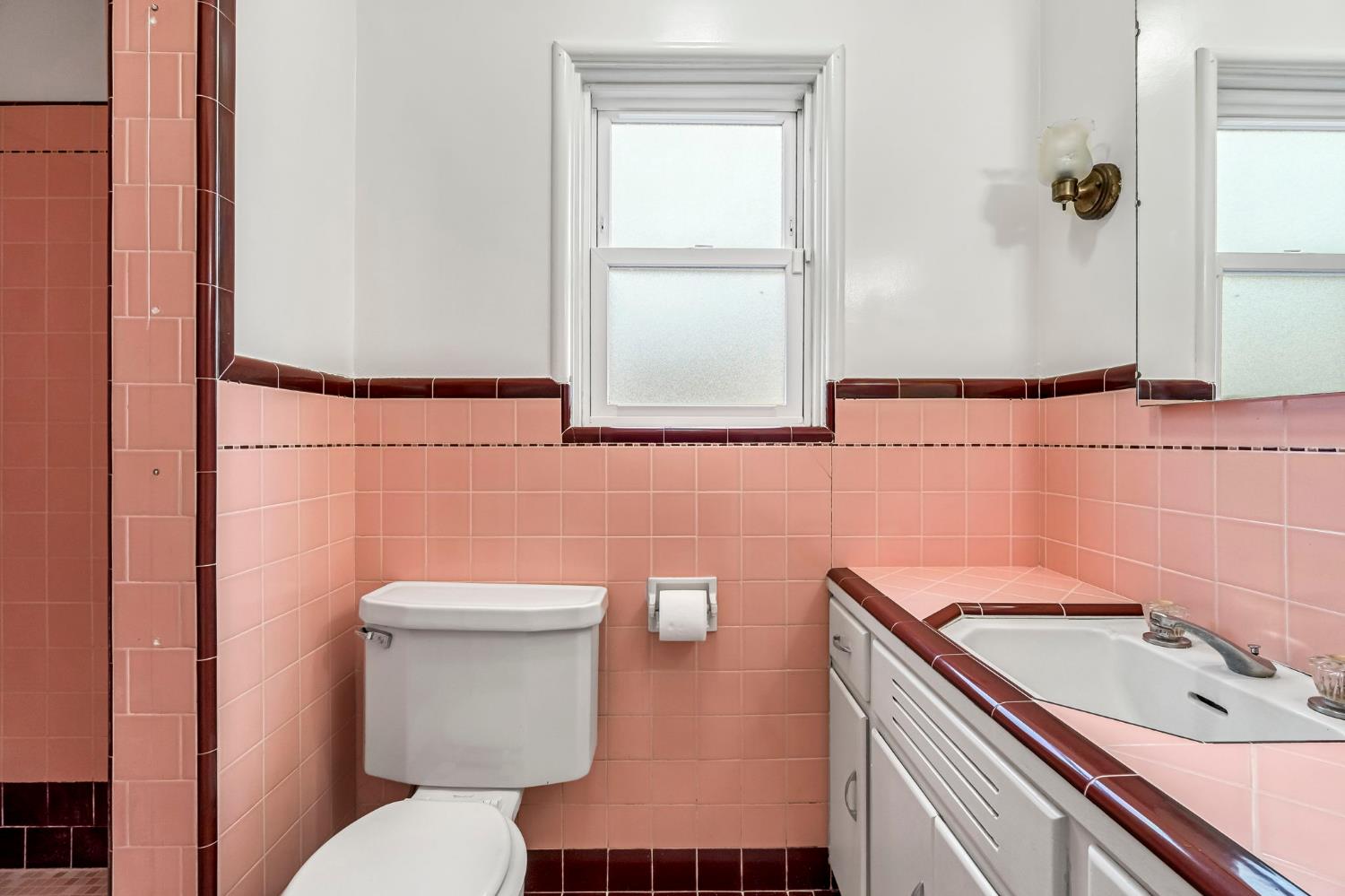 215 East Clinton Avenue Fresno, CA 93704 - Photo 23 of 29 a bathroom with a sink a toilet and shower