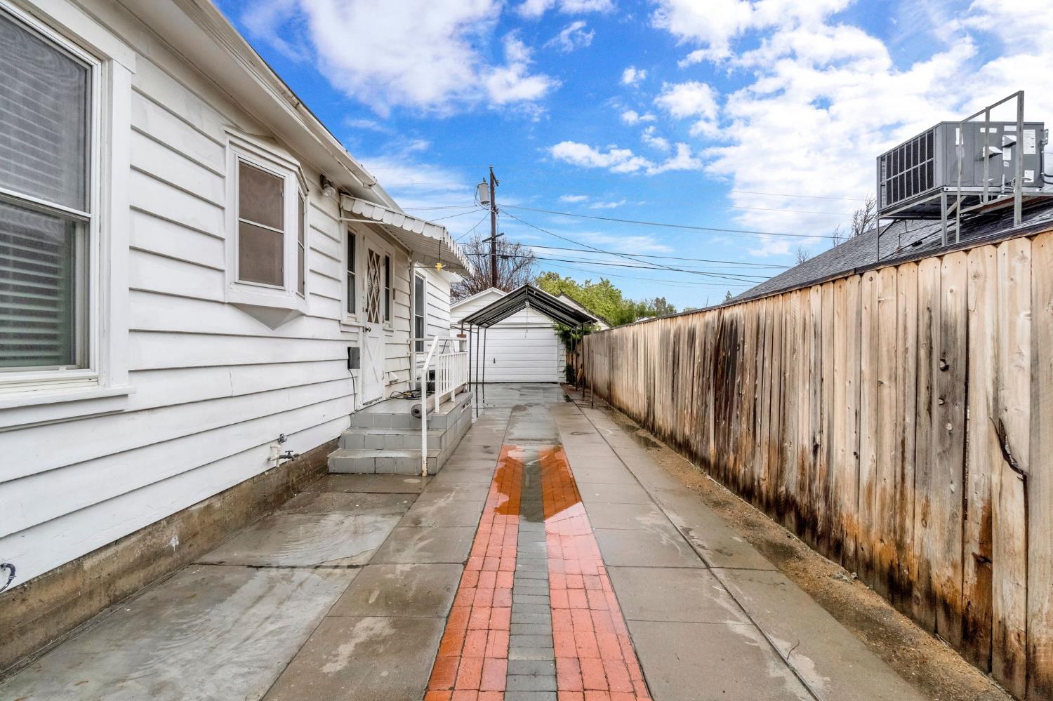 215 East Clinton Avenue Fresno, CA 93704 - Photo 26 of 29 a view of entryway with wooden floor and fence