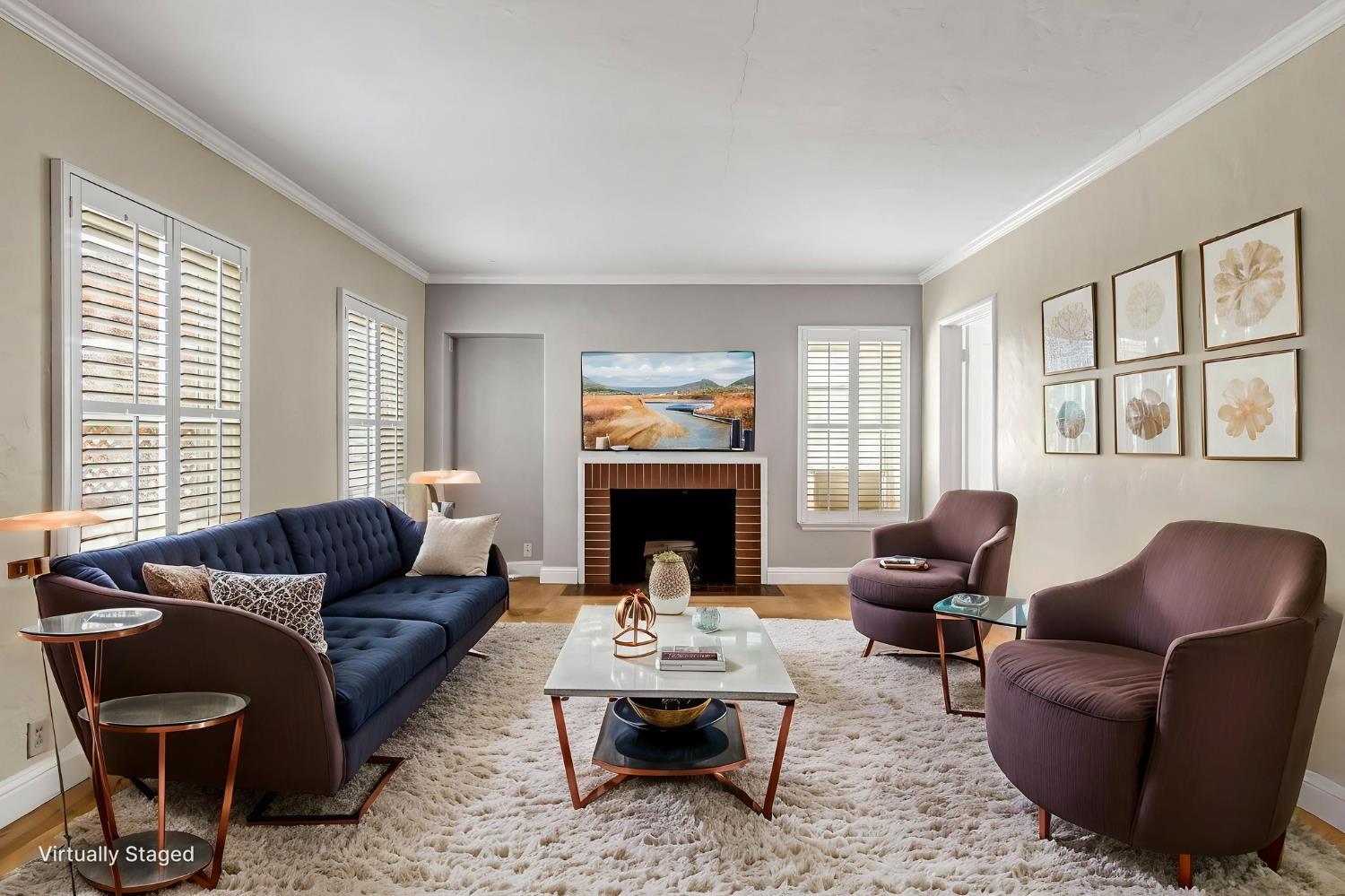 215 East Clinton Avenue Fresno, CA 93704 - Photo 5 of 29 a living room with furniture a fireplace and a large window