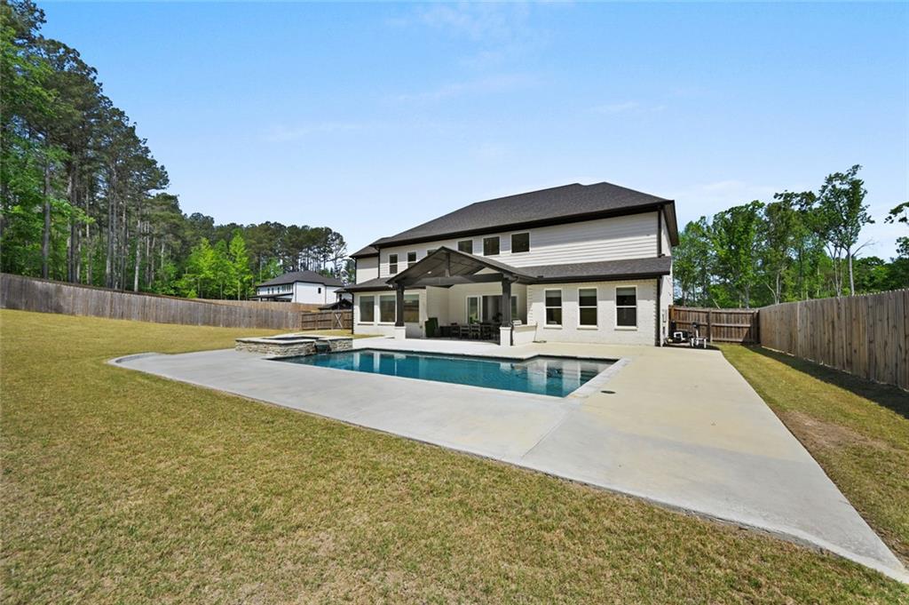 2694 Thompson Mill Road Buford, GA 30519 - Photo 69 of 70 a front view of a house with a yard