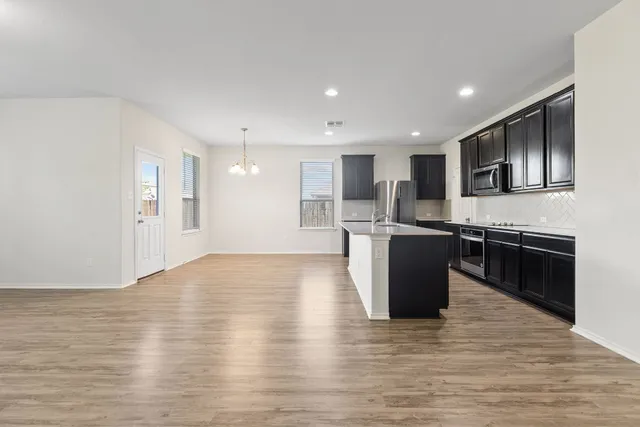 a kitchen with a sink and window