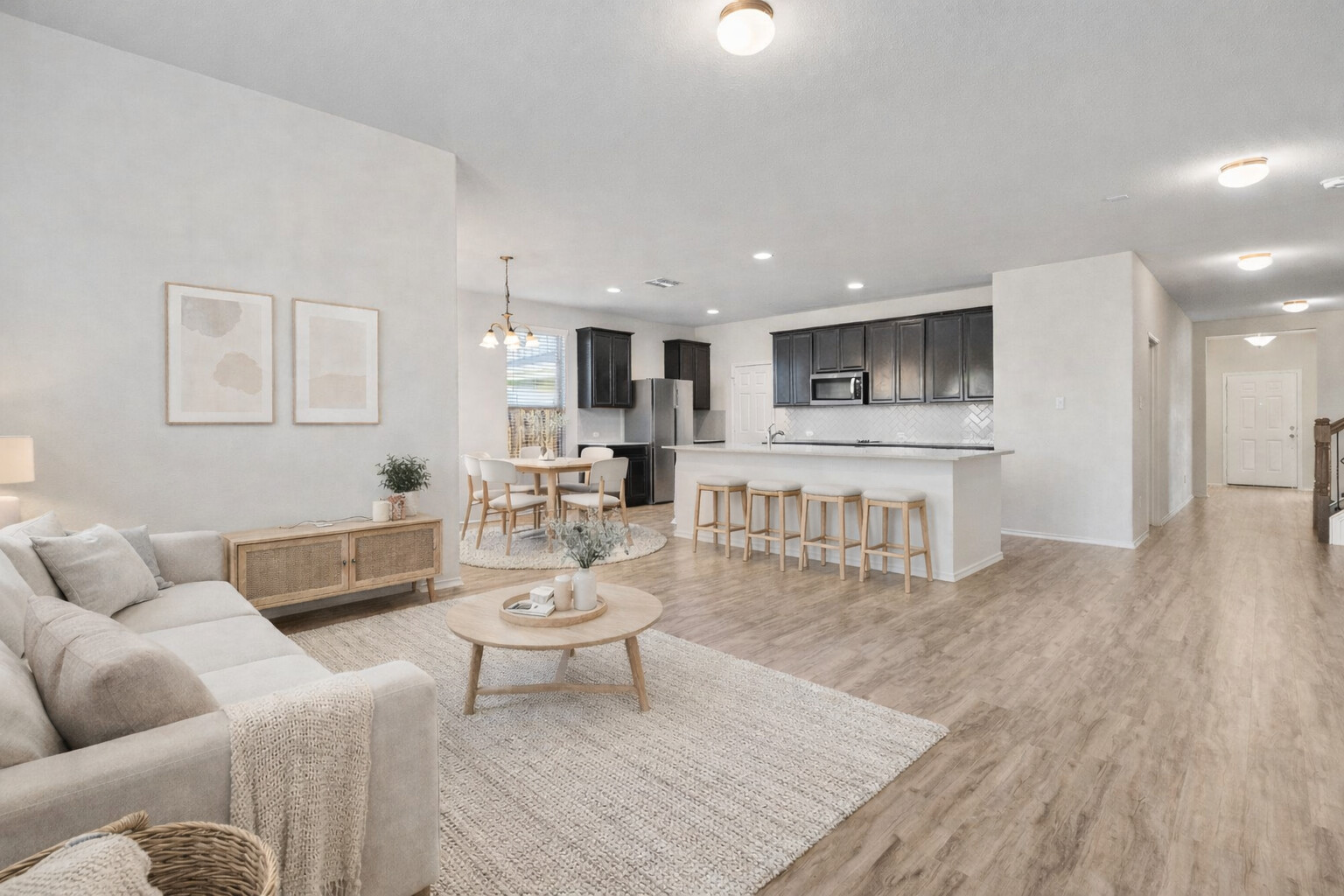 Virtually staged. Living room with a chandelier, light wood-style flooring, and recessed lighting
