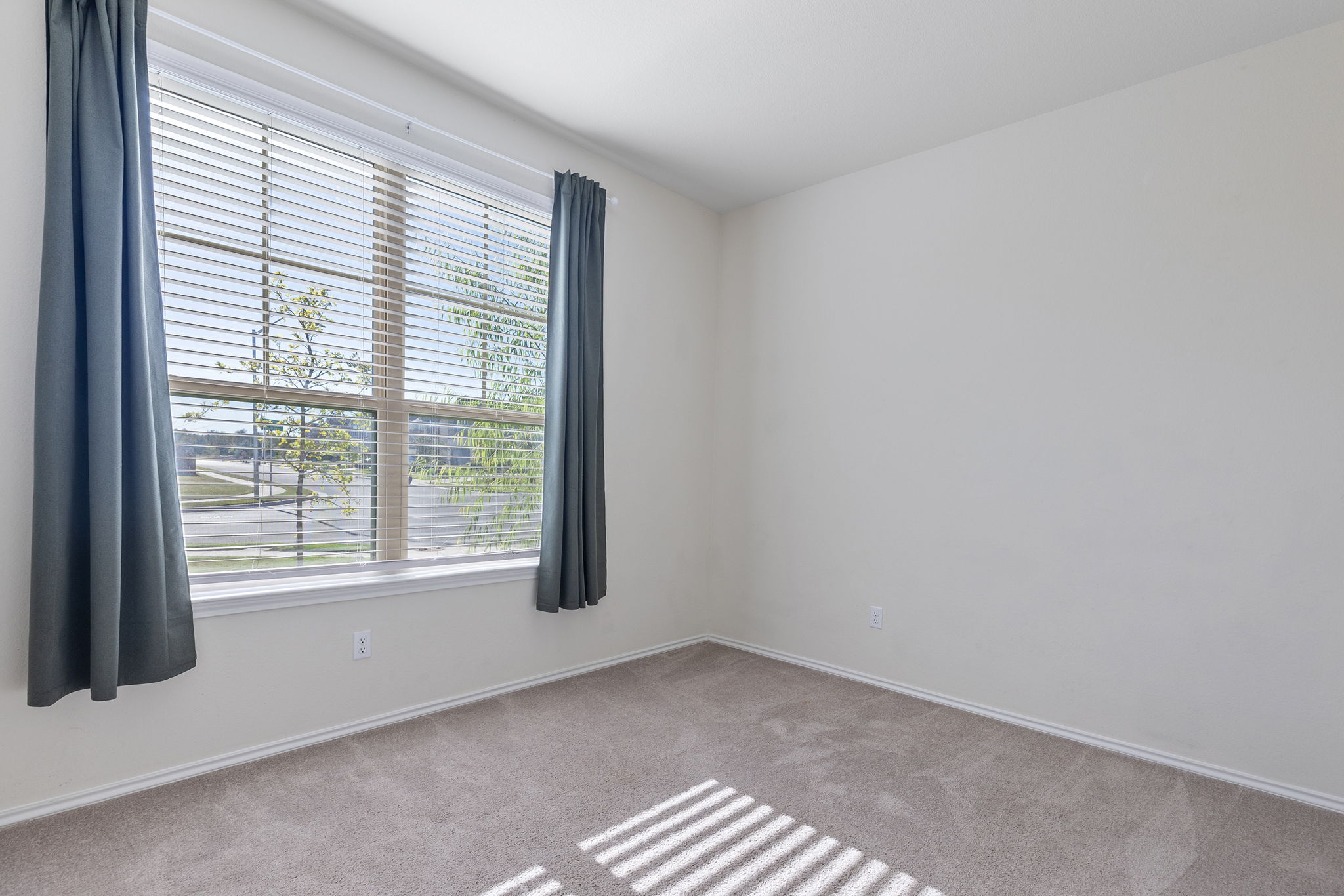 332 Spotted Rail Ridge Leander, TX 78641 - Photo 18 of 38 Main floor bedroom #3 featuring baseboards
