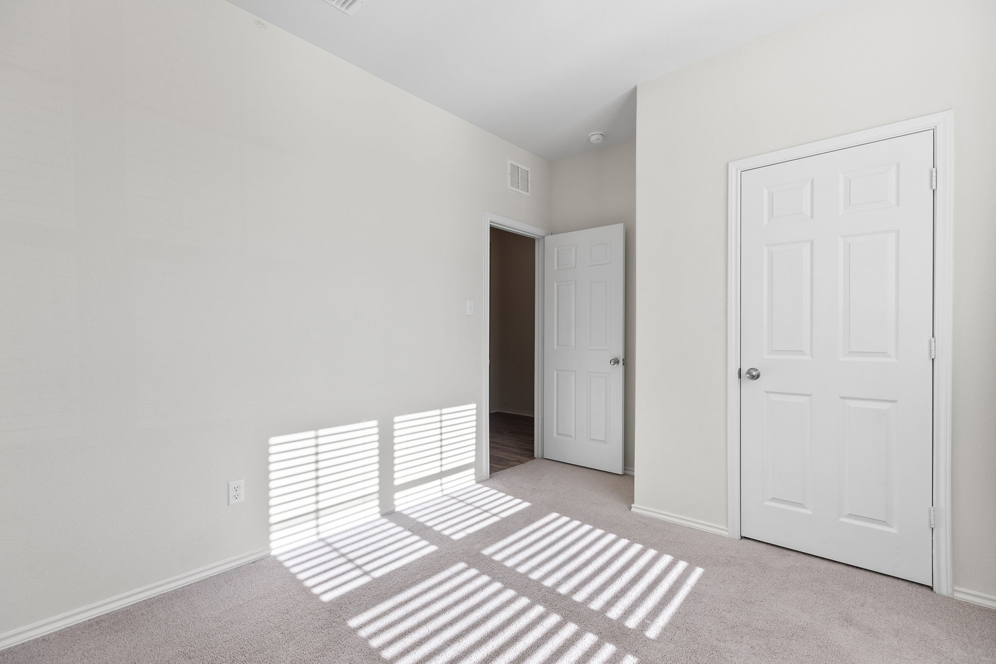 332 Spotted Rail Ridge Leander, TX 78641 - Photo 19 of 38 Main floor bedroom #3 featuring light colored carpet