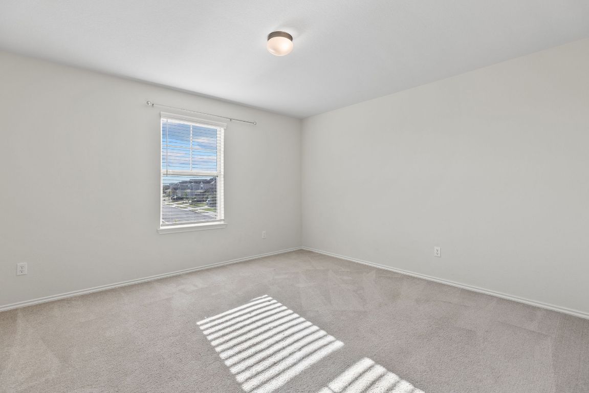 332 Spotted Rail Ridge Leander, TX 78641 - Photo 22 of 35 Bedroom #4 with light colored carpet