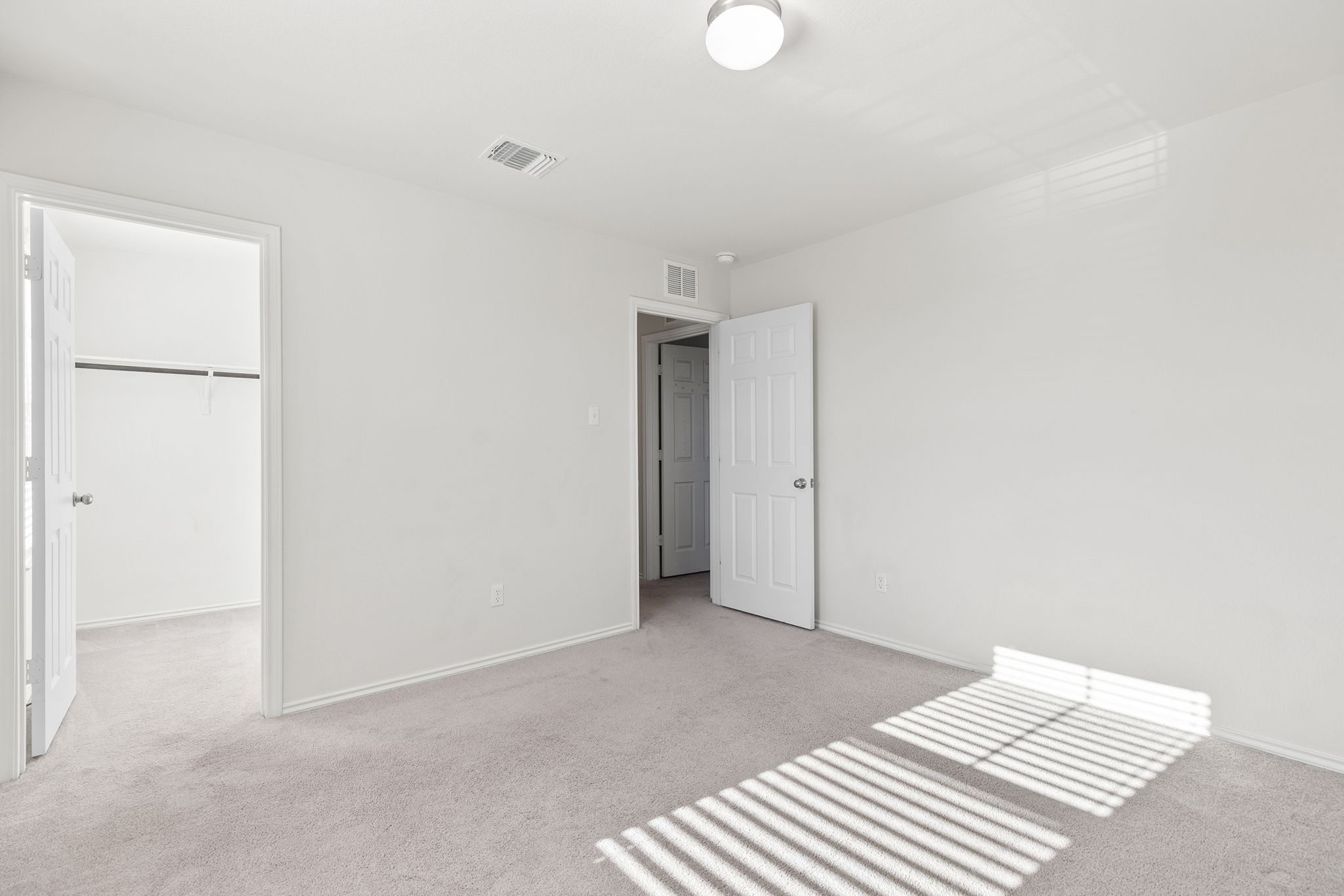 332 Spotted Rail Ridge Leander, TX 78641 - Photo 28 of 38 Bedroom #5 featuring light colored carpet and a spacious closet