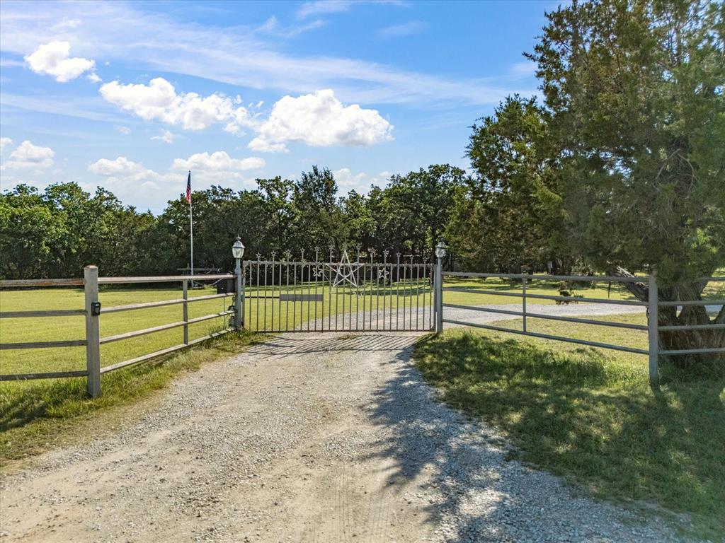 3275 Finis Road Graham, TX 76450 - Photo 2 of 36 a view of a yard with wooden fence