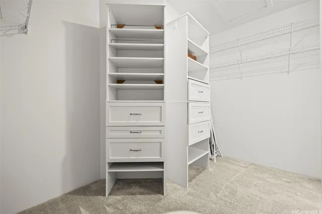a spacious bathroom with double vanity and mirrors