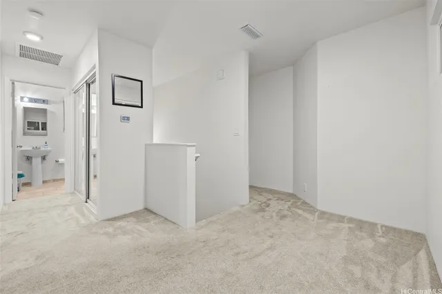 a view of a livingroom with a ceiling fan and window