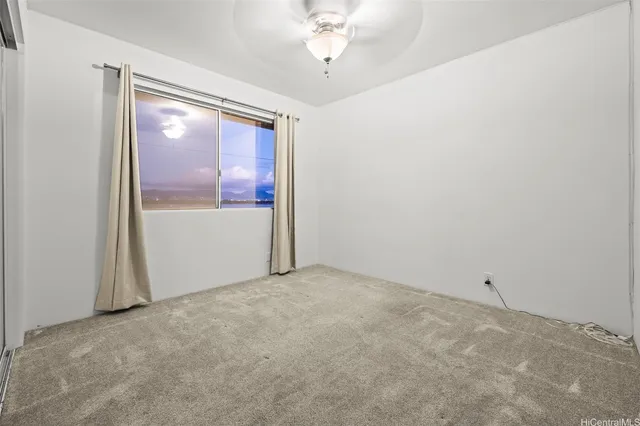 a view of a big room with windows and cabinet